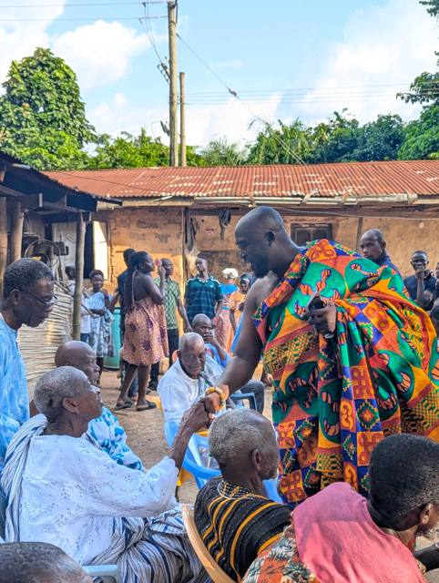 Togbe Edzeani V greets the seated Chief of Fodome Abledze, in white lace.