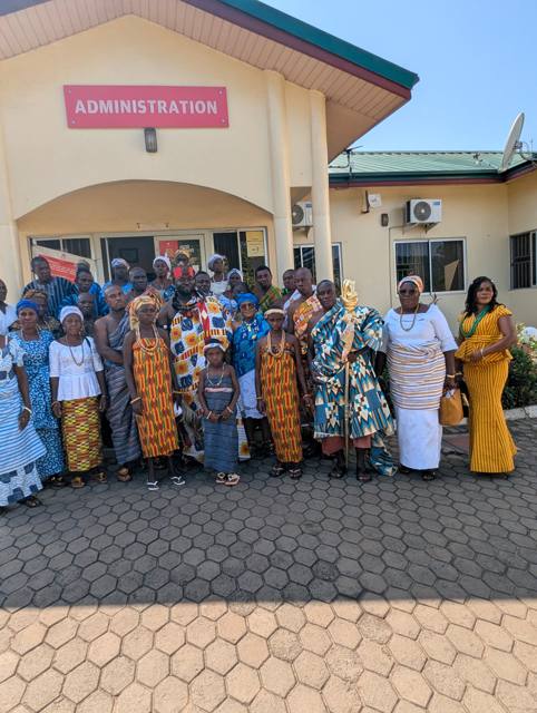 The Fodome delegation gathers with Togbe Edzeani V outside the administration building.