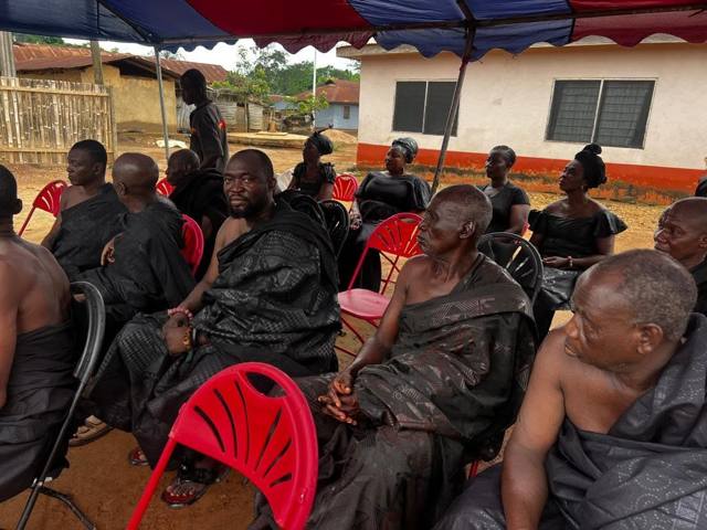 Chiefs and elders gathered under the tent.